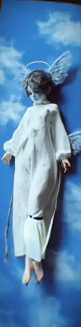 Free angel bookmark featuring an angel in a blue sky setting